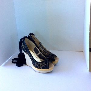 Jennifer Lopez ankle tie platform wedges.